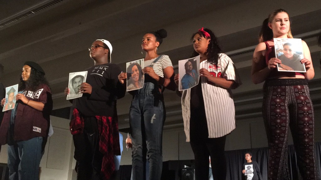 Students posed with pictures of African Americans who were killed by Police Officers