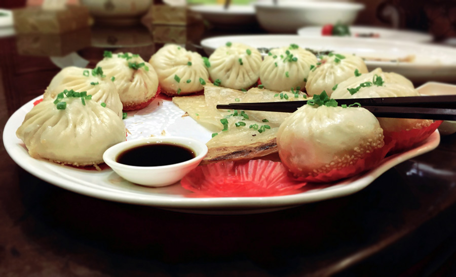 These dumplings are particularly popular in Shanghai and are known for their crisply fried bottoms and the soup that flows out once you bite into them. 