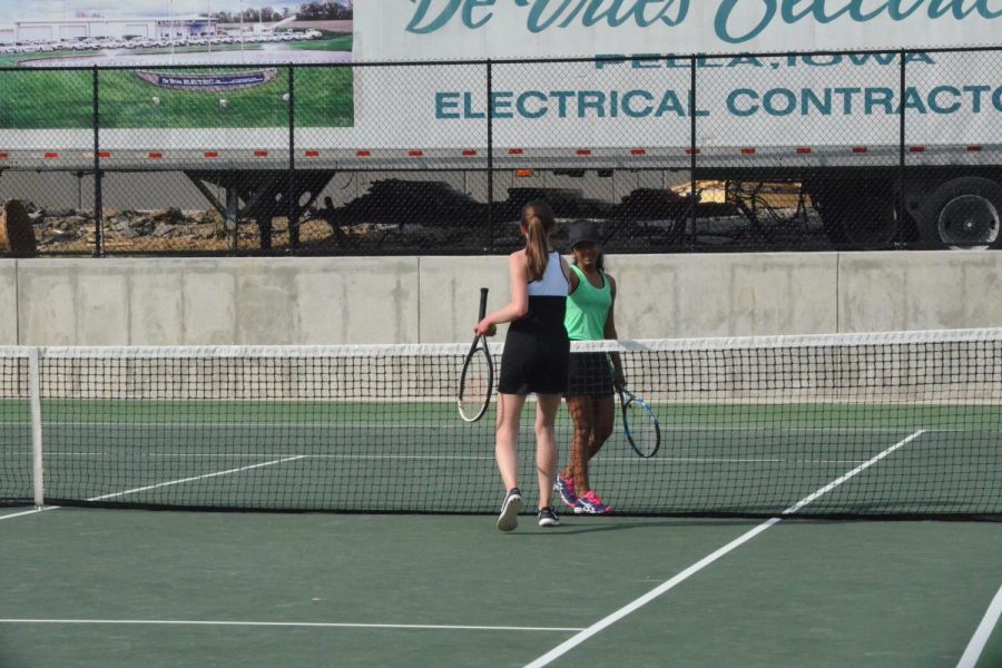 Jessica Moonjely ‘20 shakes hands with her opponent, after winning her singles match. 