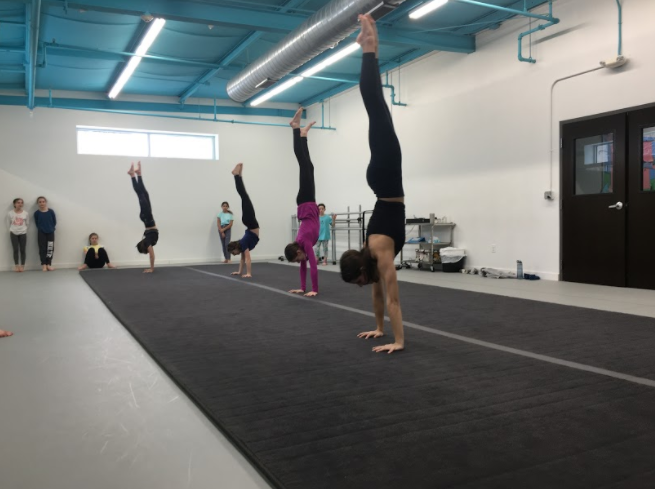 Feature/Event(Action)-- Students of Nolte Academy take on a hand-stand contest during their Acrobatics class on Saturday, January 18th.