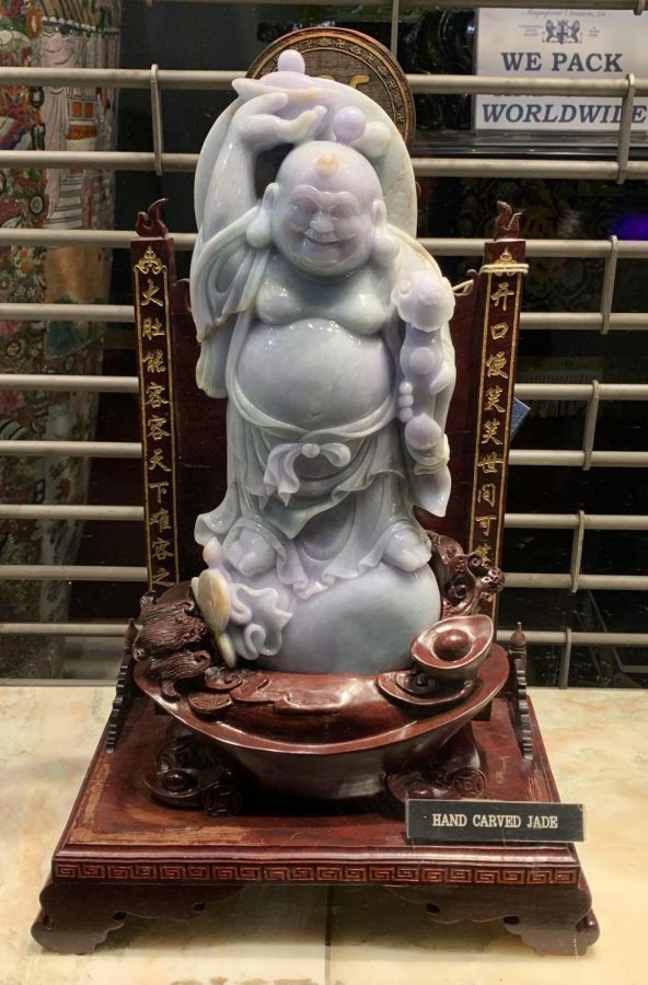 This+picture+displays+the+Laughing+Buddha.+The+Laughing+Buddha+is+always+shown+laughing+or+smiling%2C+hence+his+nickname%2C+Laughing+Buddha.+